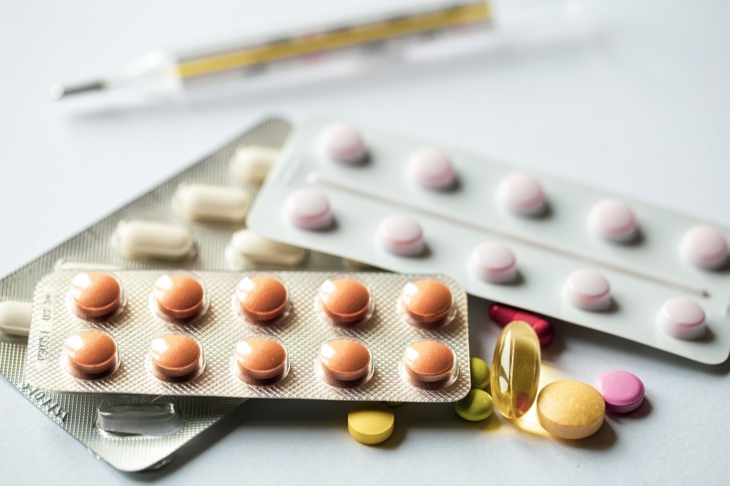 closeup assorted pills white background